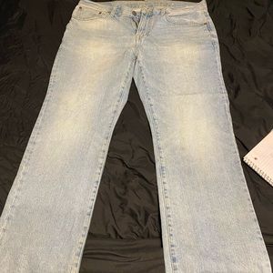 American eagle light washed original boot cut jeans .